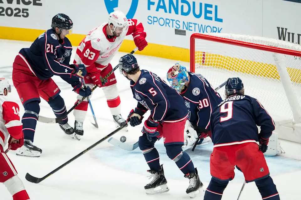 Detroit Red Wings right wing Alex Debrincat (93) scores past Columbus Blue Jackets goaltender Elvis Merzlikins (90) during the second period of the NHL hockey game at Nationwide Arena in Columbus on Dec. 4, 2025.