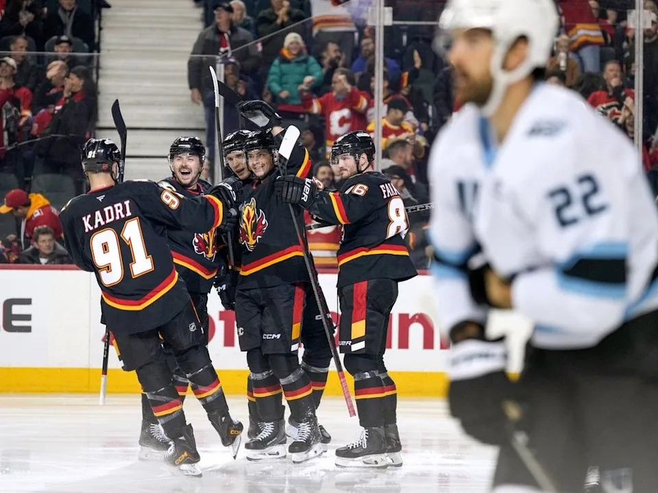  The Flames celebrate Yegor Sharangovich’s goal 16 seconds into Saturday’s game.