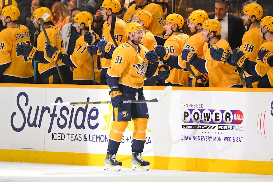 Dec 11, 2025; Nashville, Tennessee, USA; Nashville Predators center Steven Stamkos (91) celebrates with his teammates after scoring his forth goal against the St. Louis Blues during the second period at Bridgestone Arena. Mandatory Credit: Steve Roberts-Imagn Images