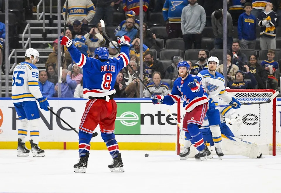 J.T. Miller (8) celebrates after scoring the game-winning goal in the Rangers’ 3-2 overtime win over the Blues in St. Louis on Dec. 18, 2025. Jeff Curry-Imagn Images