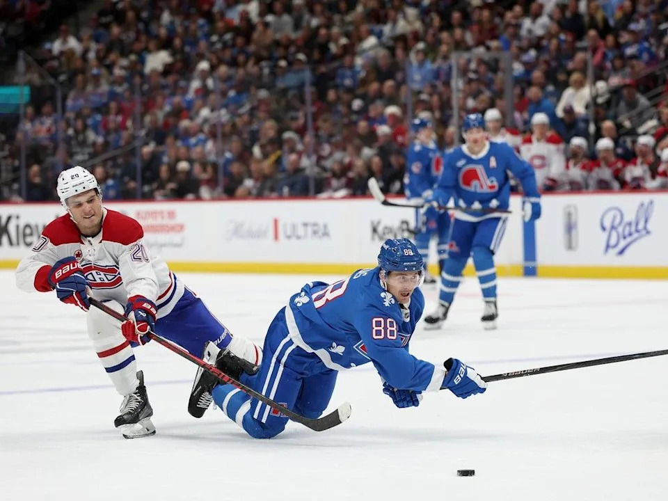  Canadiens winger Juraj Slafkovsky fights for control of the puck against Colorado Avalanche’s Martin Necas in Denver on Saturday.