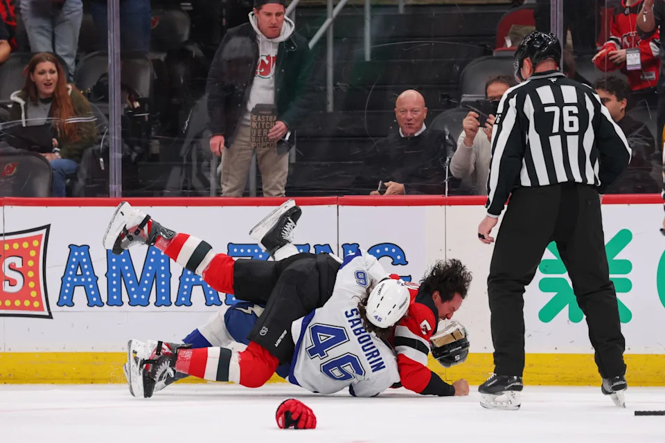New Jersey Devils defenseman Brenden Dillon (5) and Tampa Bay Lightning right wing Scott Sabourin (46) fight at Prudential Center.Ed Mulholland-Imagn Images