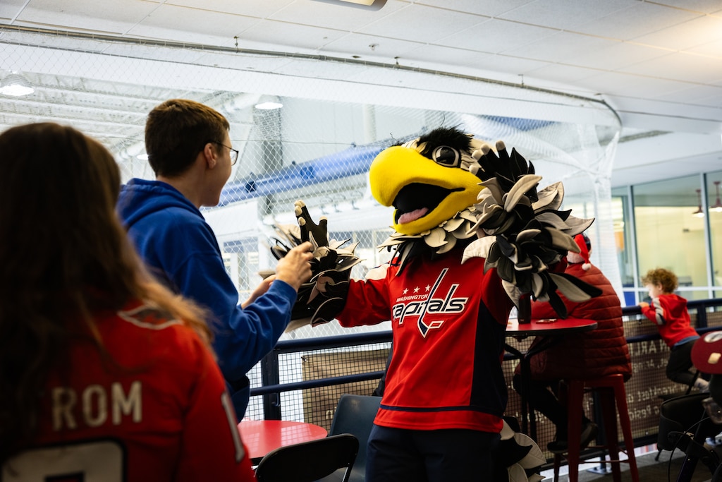 Teams from The American Special Hockey Association, including the Montgomery County Cheetahs, greet the Capitals mascot as they prepare to play with Capitals players Alexander Ovechkin, Justin Sourdif, Ethen Frank and veteran Mike Green at the Medstar Iceplex in Arlington, VA on December 10, 2025.