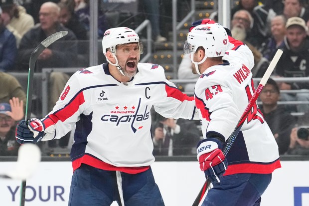 Washington Capitals right wing Tom Wilson, right, celebrates his goal...