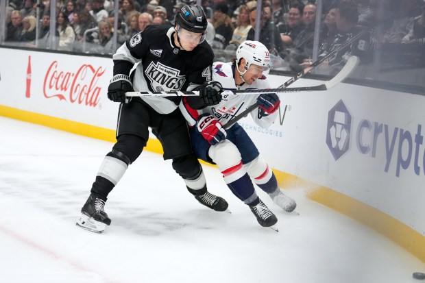 Kings defenseman Jacob Moverare, left, and Washington Capitals right wing...