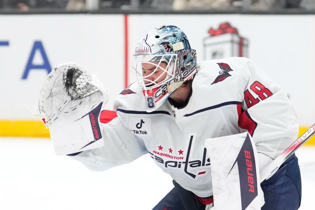 Washington Capitals goaltender Logan Thompson makes a glove save during...