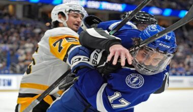 Tampa Bay Lightning center Dominic James (17) and Pittsburgh Penguins defenseman Connor Clifton (75) scrap during the second period of an NHL hockey game Thursday, Dec. 4, 2025, in Tampa, Fla. (AP Photo/Chris O'Meara)