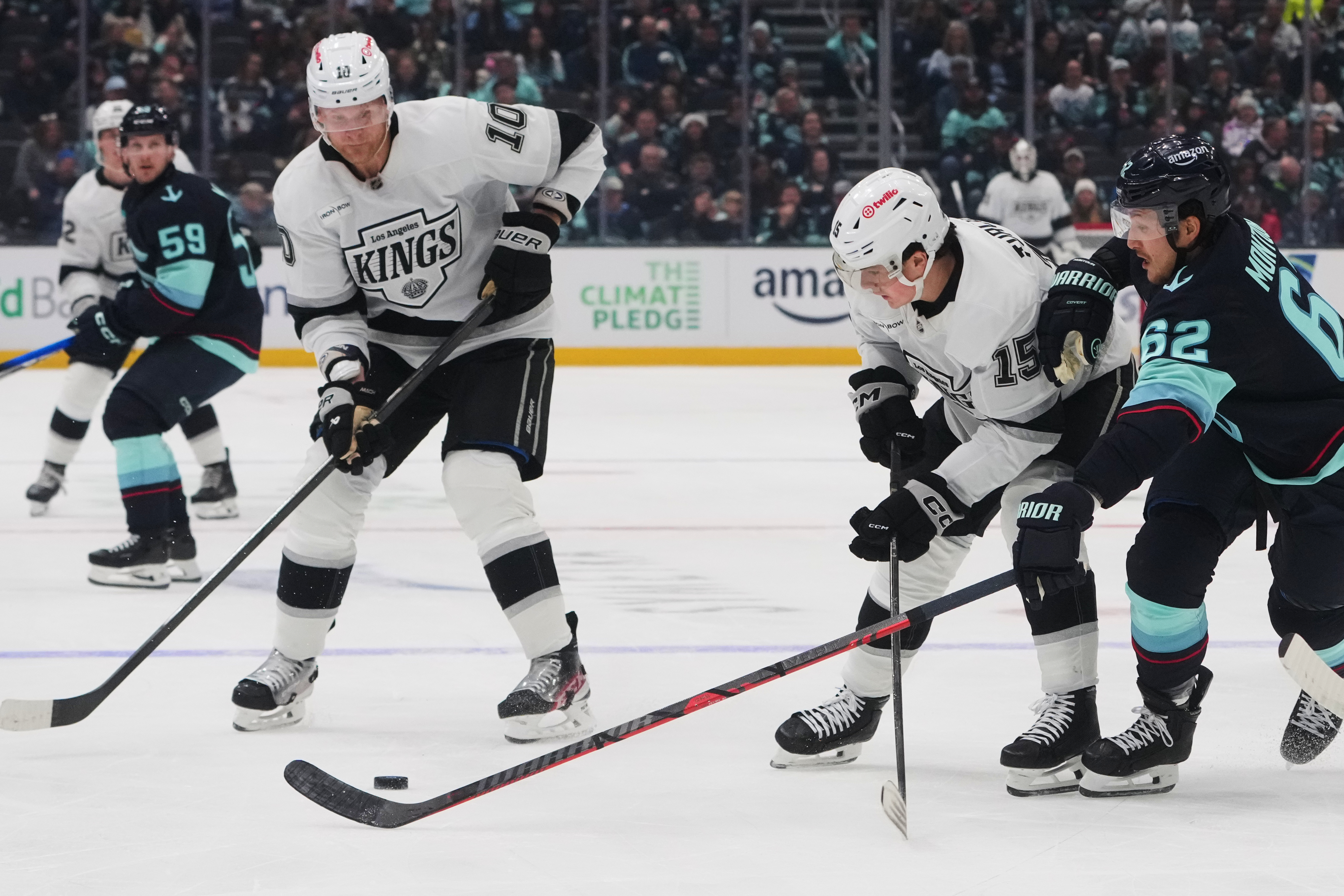 Kings right wing Corey Perry (10) looks to pick up...