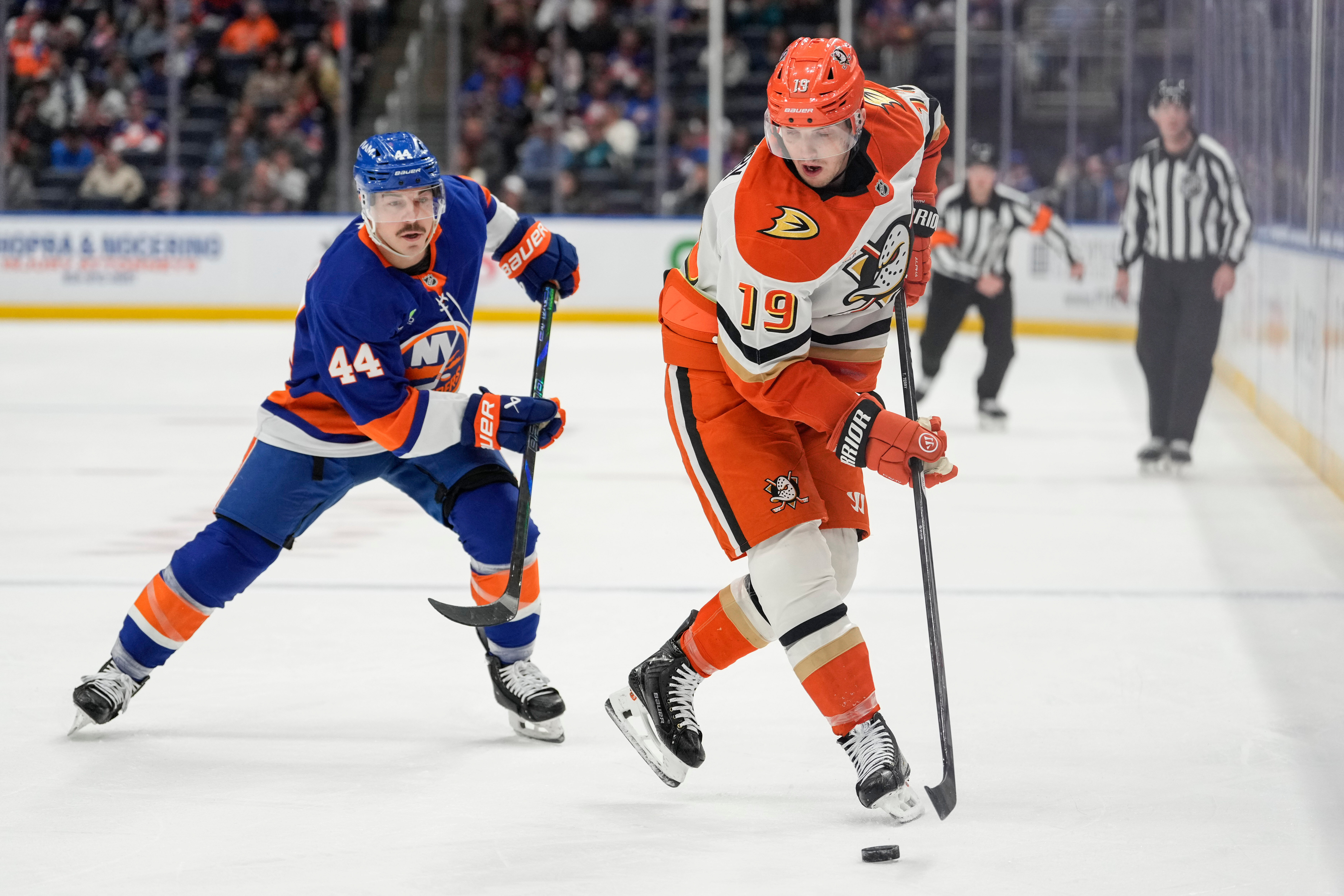 Ducks right wing Troy Terry, right, battles for control of...