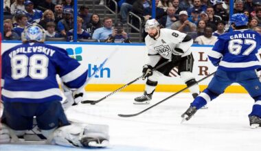 Los Angeles Kings defenseman Drew Doughty (8) looks to shoot between Tampa Bay Lightning goaltender Andrei Vasilevskiy (88) and defenseman Declan Carlile (67) during the third period of an NHL hockey game Thursday, Dec. 18, 2025, in Tampa, Fla. (AP Photo/Chris O'Meara)
