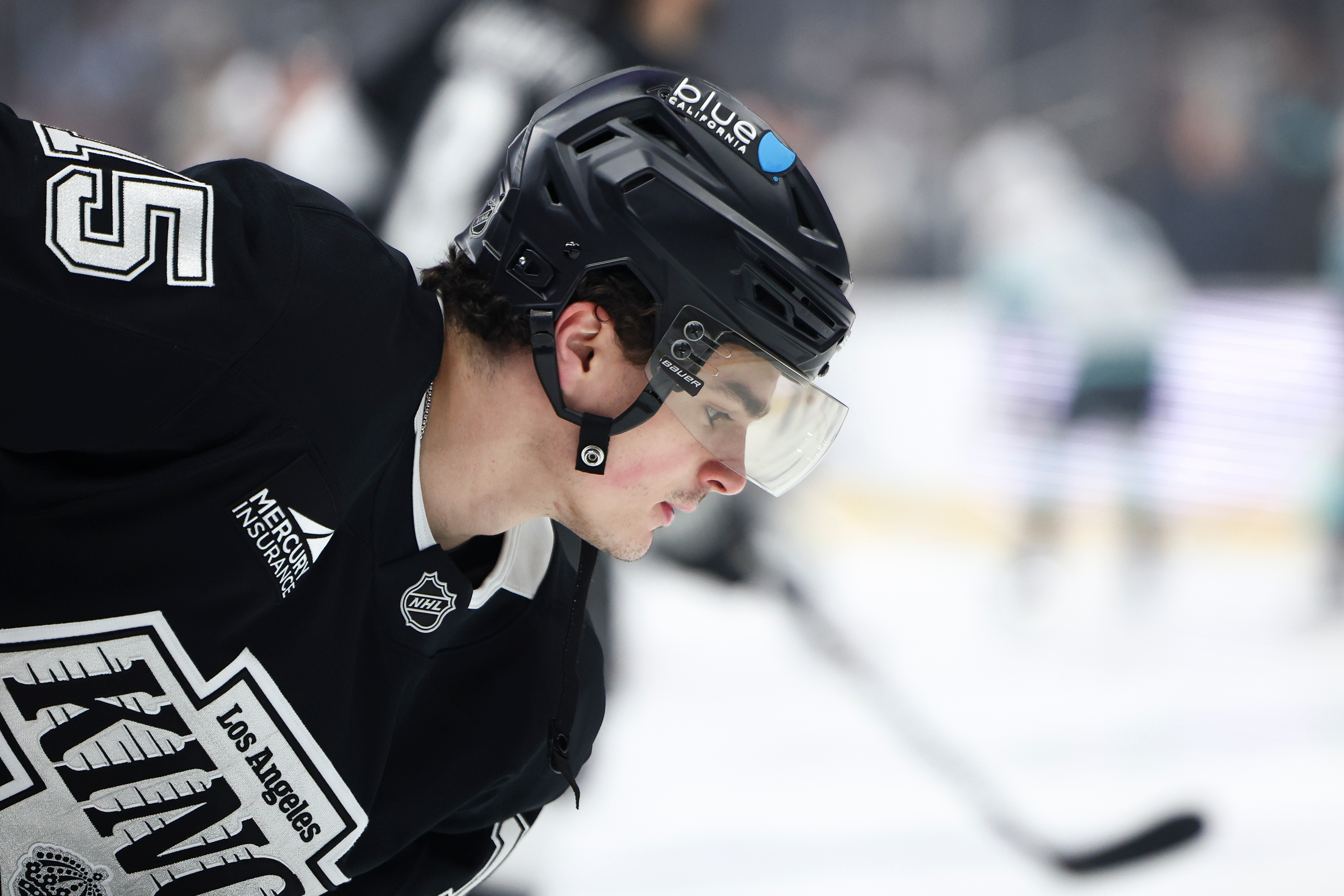 Kings center Alex Turcotte looks on before a game against...