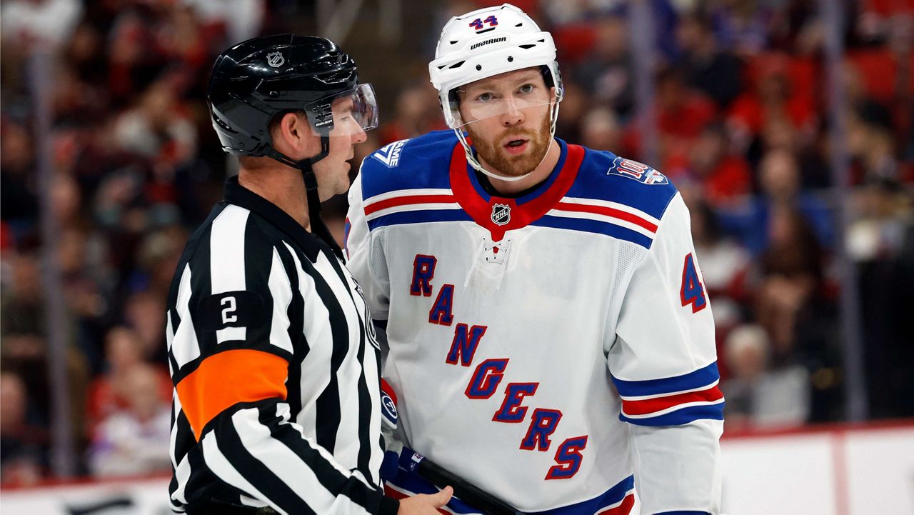 New York Rangers' Vladislav Gavrikov gets an explanation from an official during the second period of an NHL hockey game against the Carolina Hurricanes in Raleigh, N.C., Wednesday, Nov. 26, 2025. (AP Photo/Karl DeBlaker)
