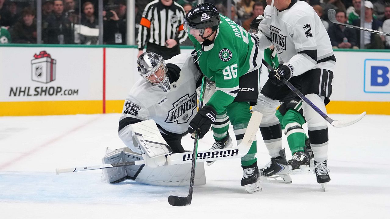 Los Angeles Kings goaltender Darcy Kuemper, left, collides with Dallas Stars right wing Mikko Rantanen during the first period of an NHL hockey game Monday, Dec. 15, 2025, in Dallas. (AP Photo/Julio Cortez)