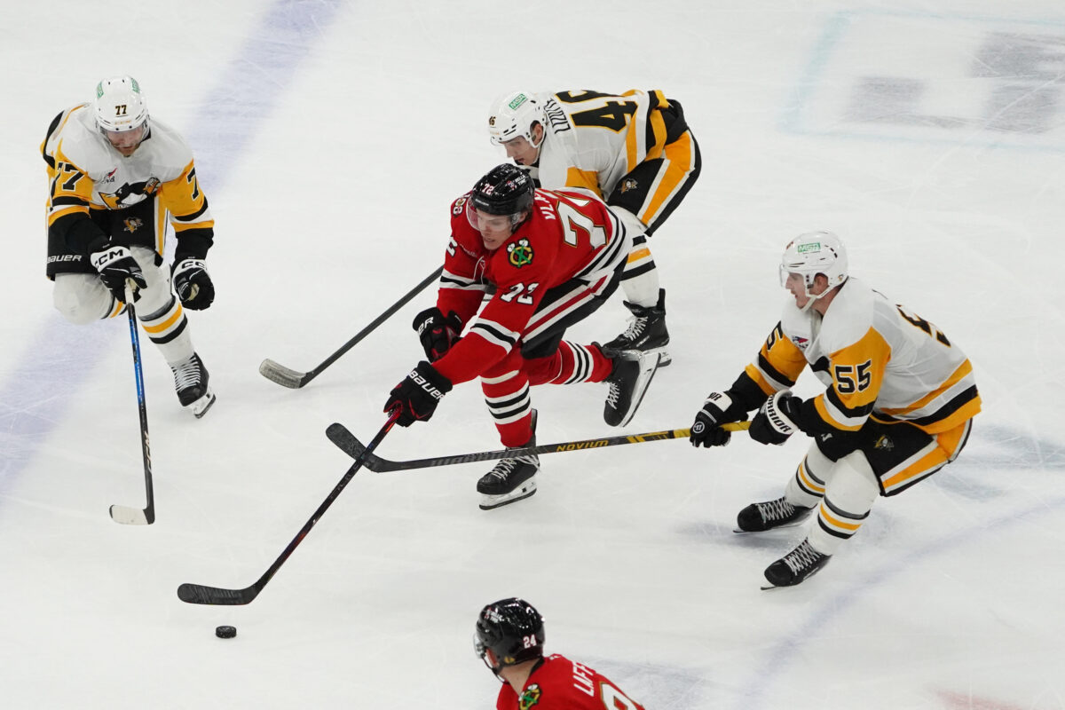 Dec 28, 2025; Chicago, Illinois, USA; Pittsburgh Penguins center Noel Acciari (55) defends Chicago Blackhawks defenseman Alex Vlasic (72) during the third period at United Center.