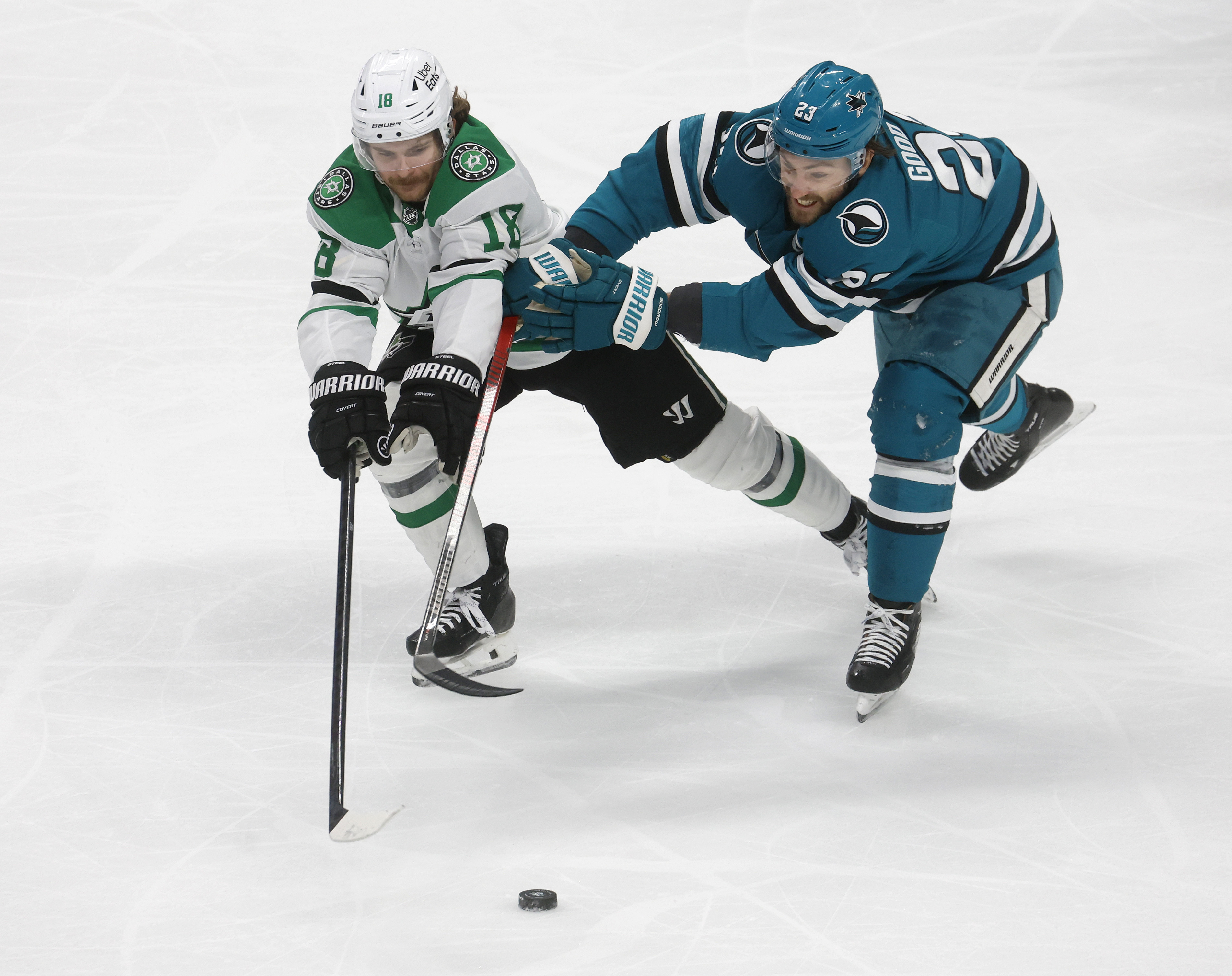 San Jose Sharks' Barclay Goodrow (23) fights for the puck...