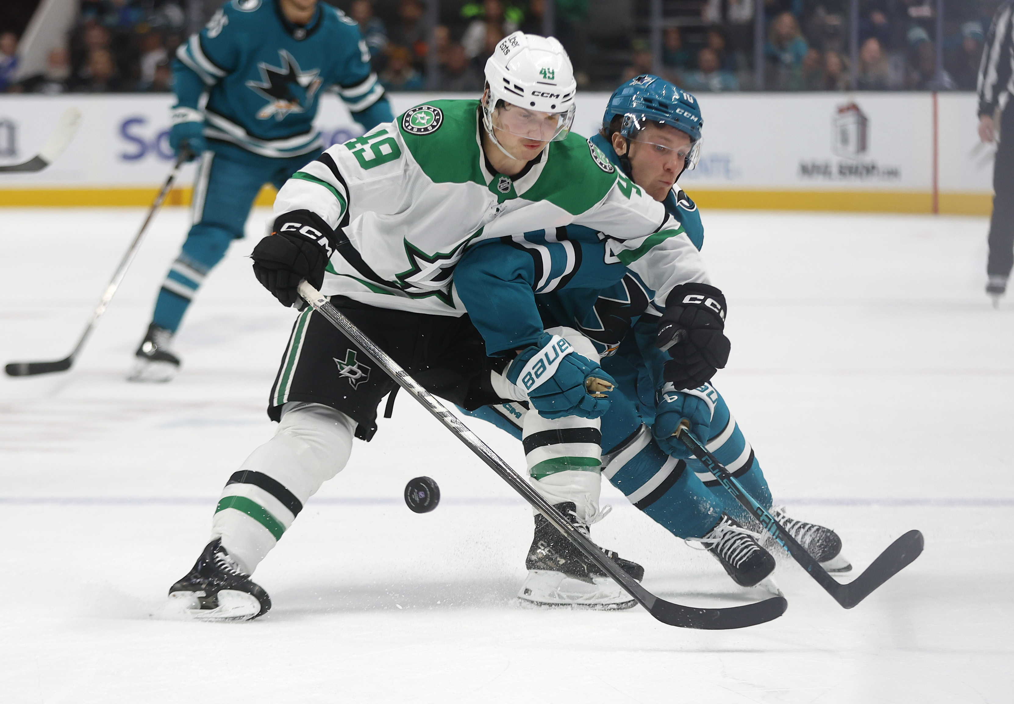 San Jose Sharks’ Ty Dellandrea (10) fights for the puck...