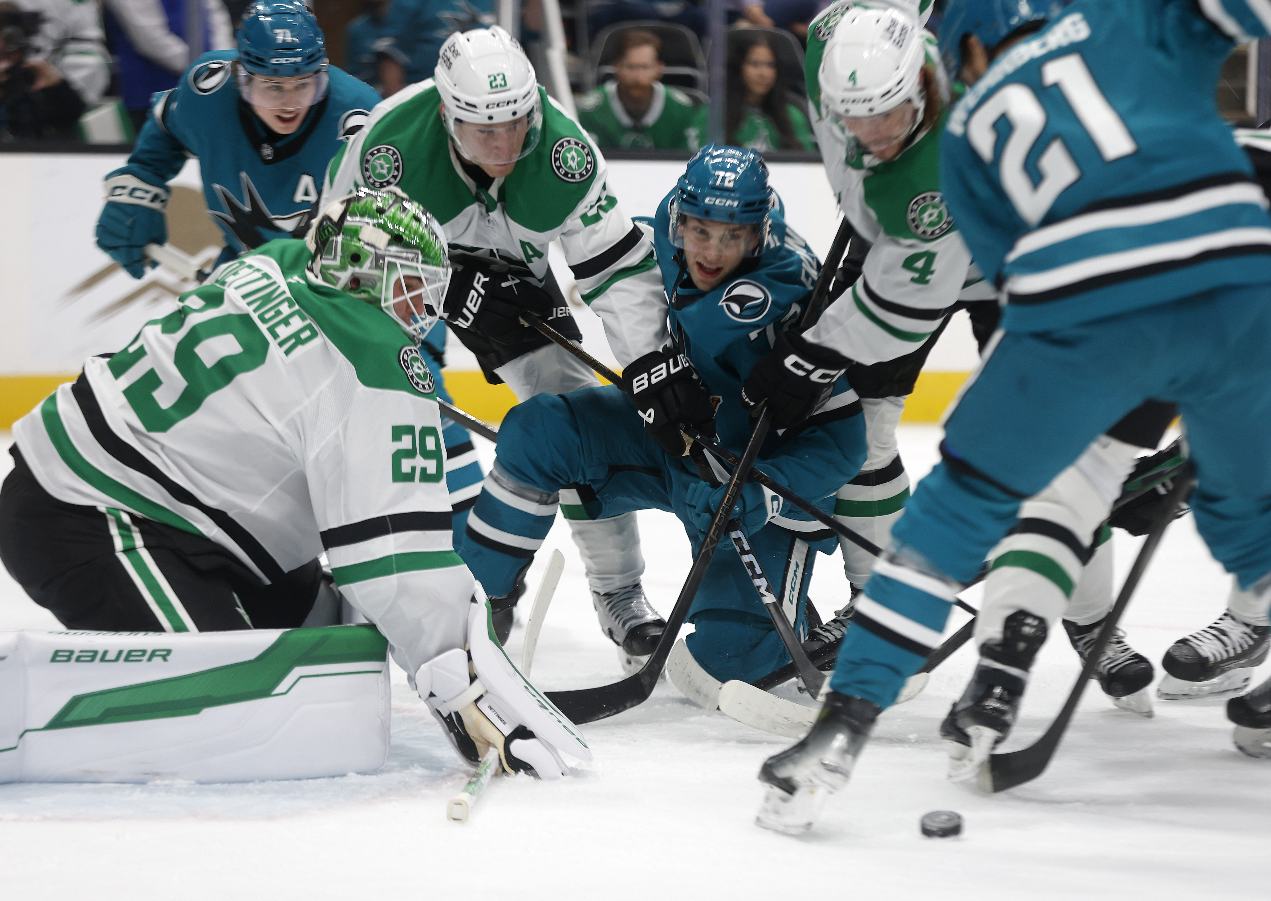 San Jose Sharks' William Eklund (72) fights for the puck...
