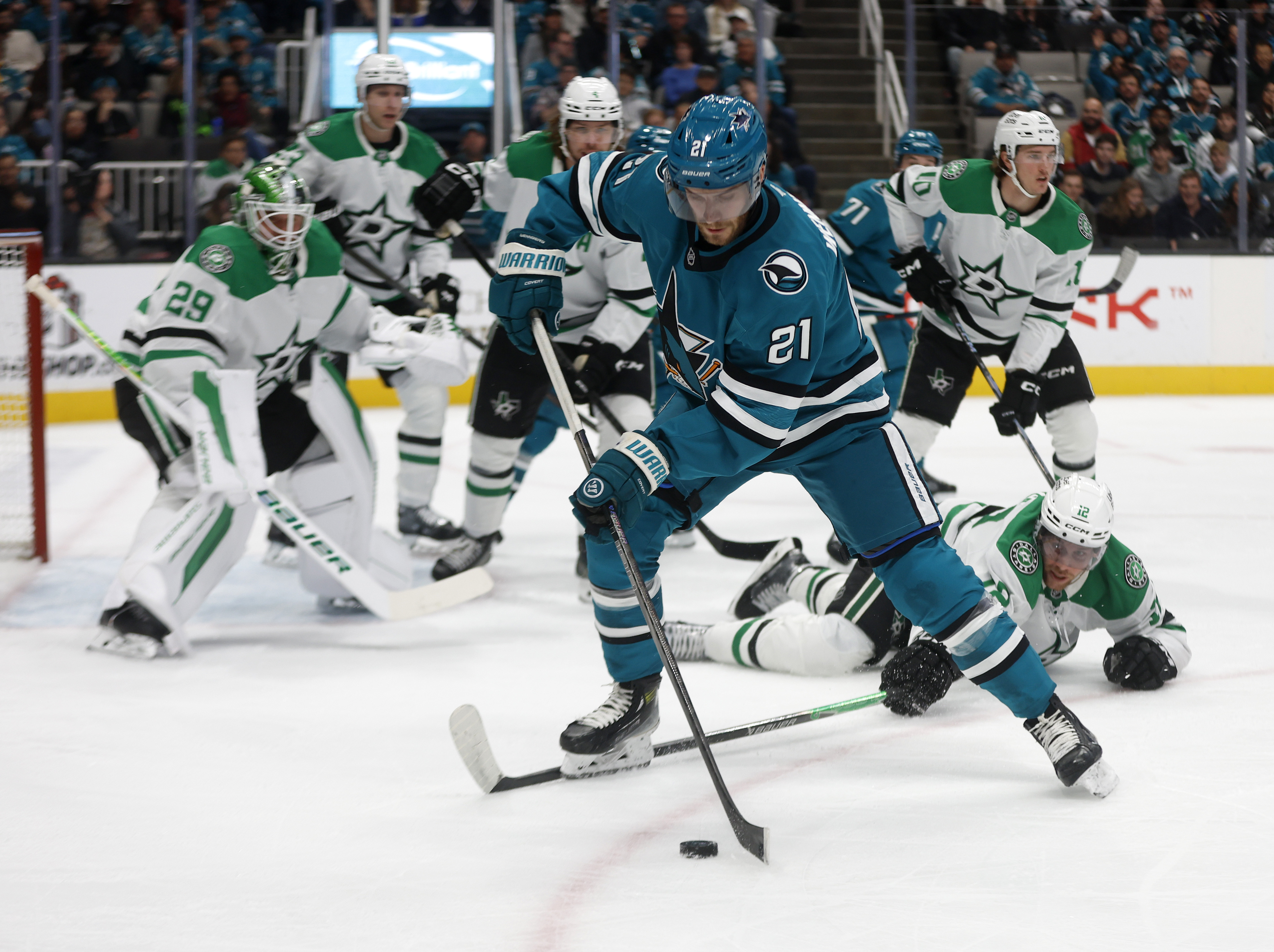 San Jose Sharks' Alexander Wennberg (21) controls the puck against...