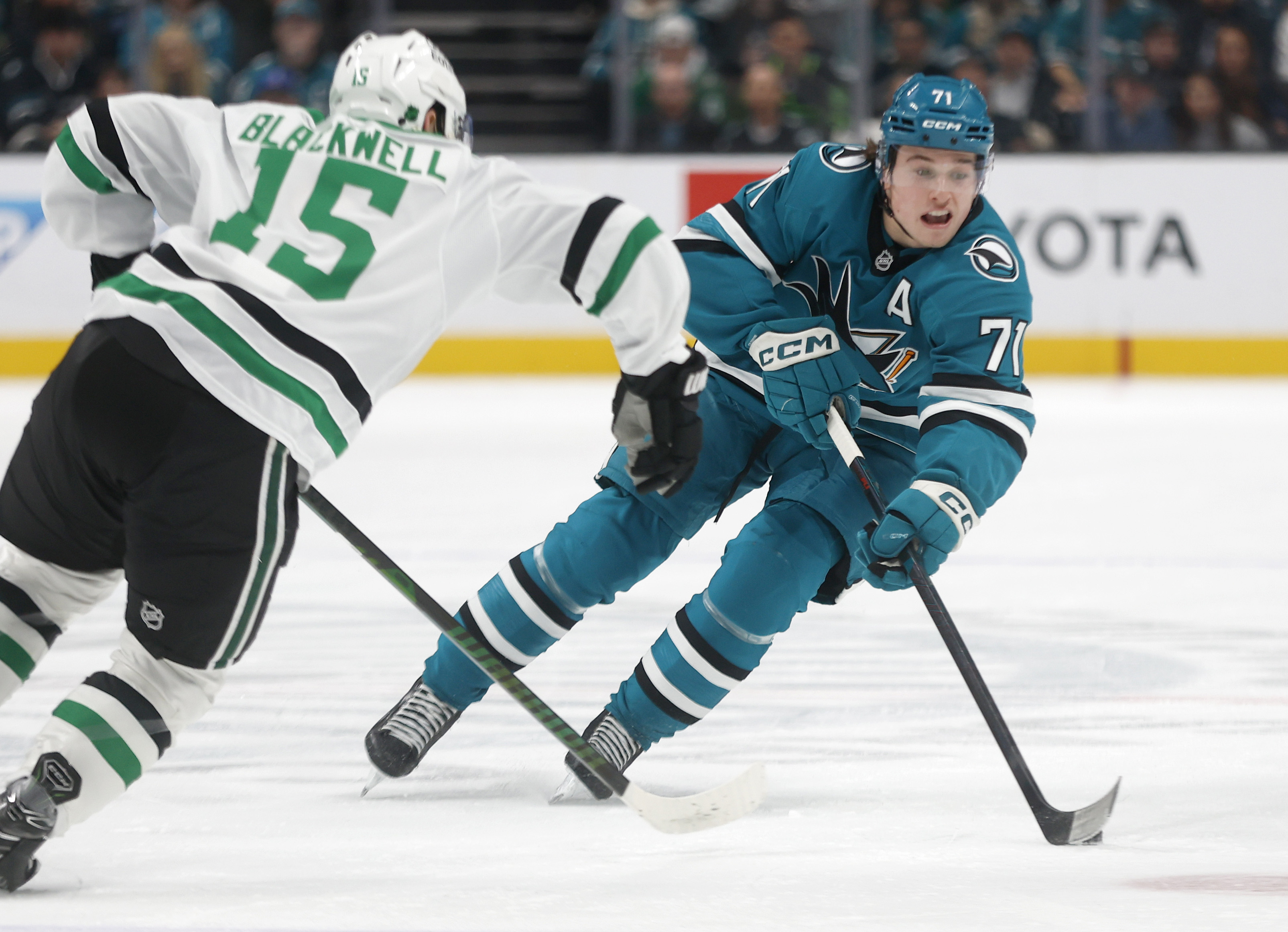 San Jose Sharks’ Macklin Celebrini (71) controls the puck against...
