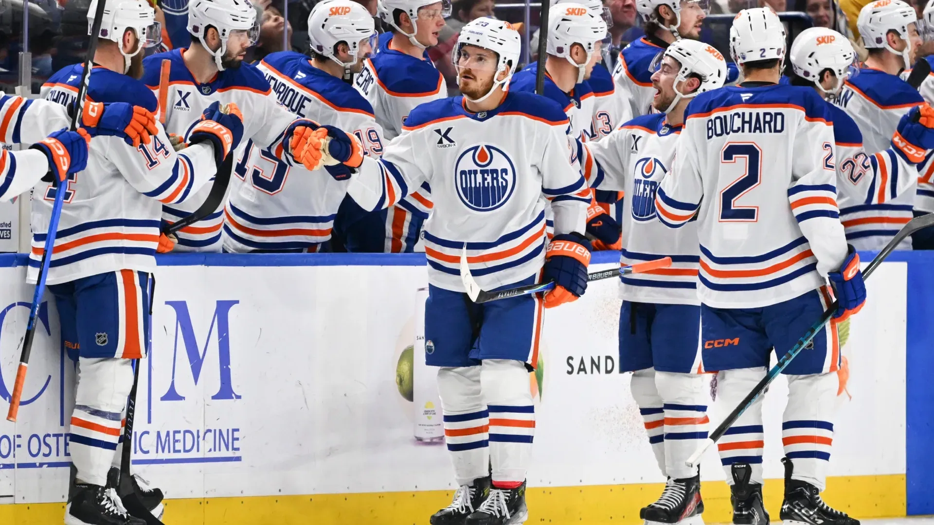 Jack Roslovic #28 of the Edmonton Oilers celebrates his goal with teammates on the bench . Joe Hrycych/Getty Images
