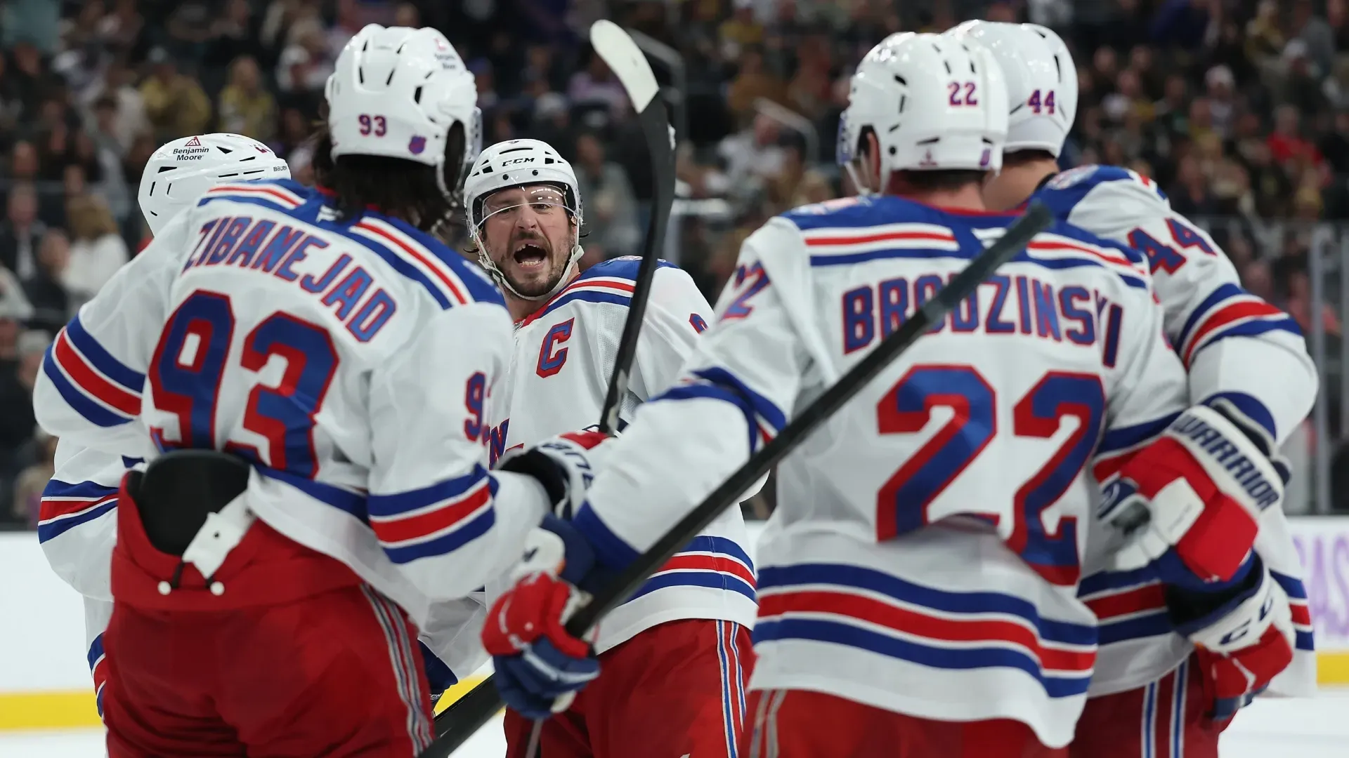 J.T. Miller #8 of the Rangers celebrates with teammates after assisting a a goal during the NHL game. Christian Petersen/Getty Images