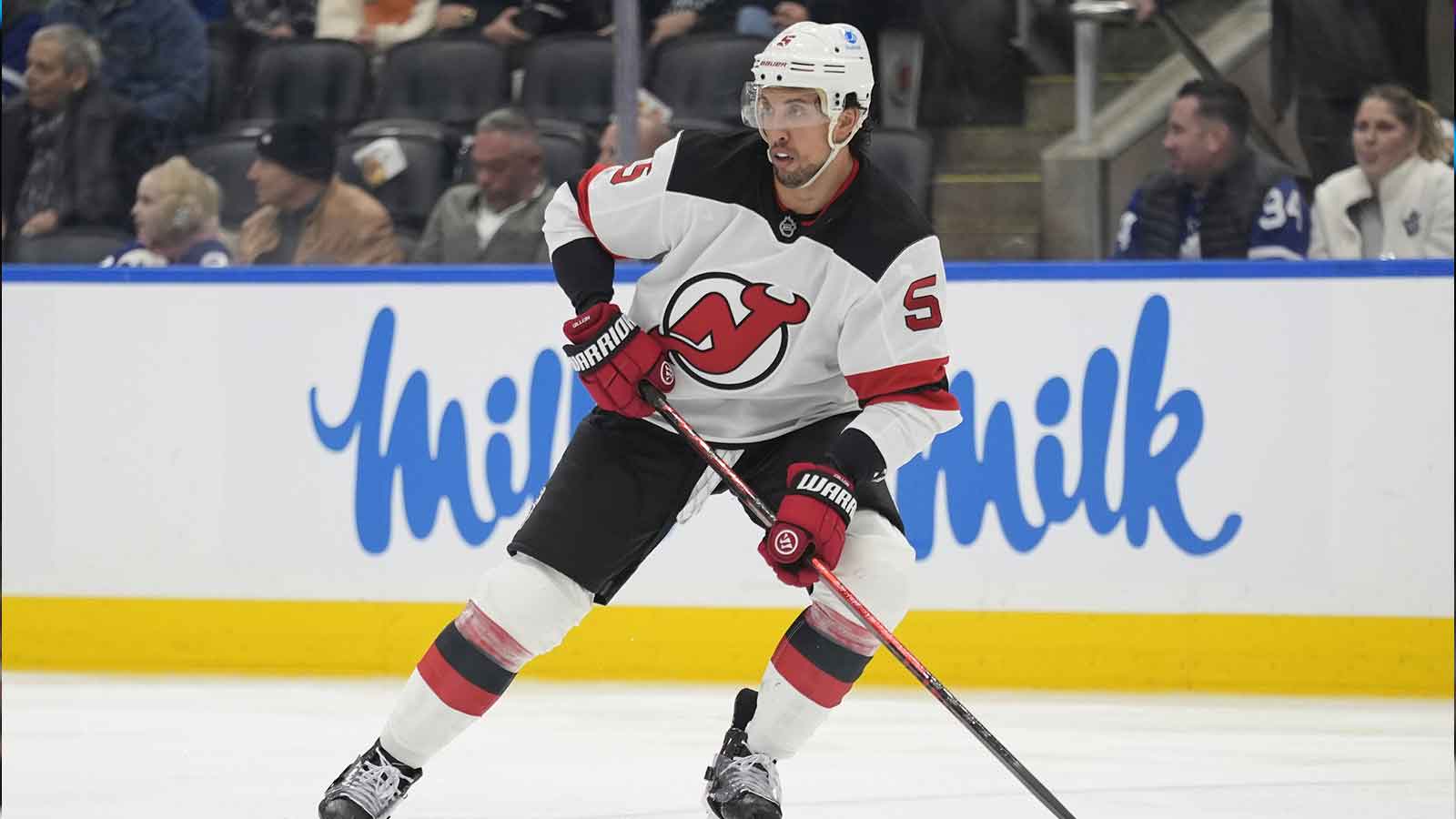 New Jersey Devils defenseman Brenden Dillon (5) controls the puck against the Toronto Maple Leafs during the third period at Scotiabank Arena.