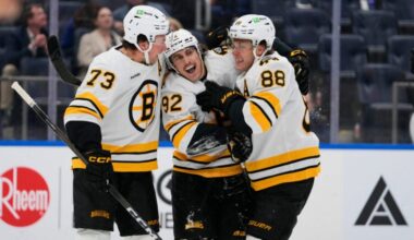Boston Bruins' Marat Khusnutdinov (92) celebrates with David Pastrnak (88) and Charlie McAvoy (73) after scoring a goal during the third period of an NHL hockey game against the New York Islanders Tuesday, Nov. 4, 2025, at UBS Arena in Elmont, N.Y.