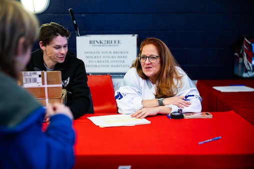 Jen O’Brien, director of ASHA, gets players from The American Special Hockey Association after they finish playing with Capitals players Alexander Ovechkin, Justin Sourdif, Ethen Frank and veteran Mike Green at the Medstar Iceplex in Arlington, VA on December 10, 2025.