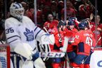 Washington Capitals' Aliaksei Protas celebrates his goal with teammates during the first period against Toronto Maple Leafs goaltender Dennis Hildeby, Thursday, Dec. 18, 2025, in Washington. 