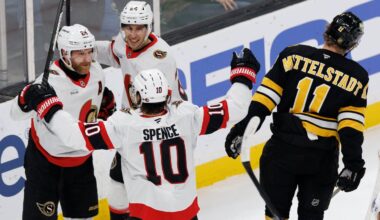 Beside a despondent Casey Mittelstadt (11), Senators forward Claude Giroux (28) celebrates his first-period goal with teammates Dylan Cozens and Jordan Spence (10) in Sunday night's victory over the Bruins at TD Garden.