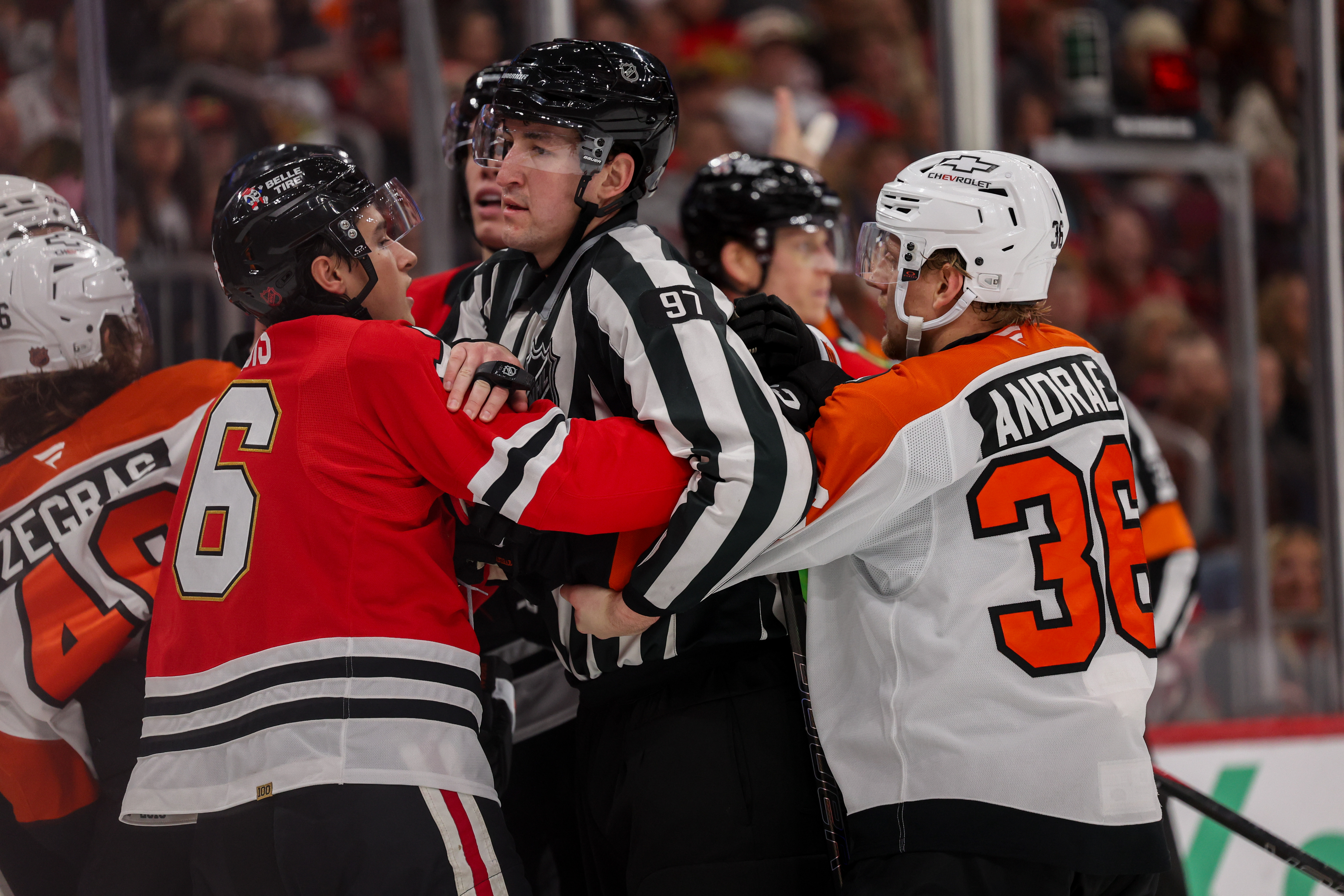 Chicago Blackhawks left wing Nick Lardis (76) and Philadelphia Flyers defenseman Emil Andrae (36) are separated during the second period at the United Center Tuesday Dec. 23, 2025 in Chicago. (Armando L. Sanchez/Chicago Tribune)