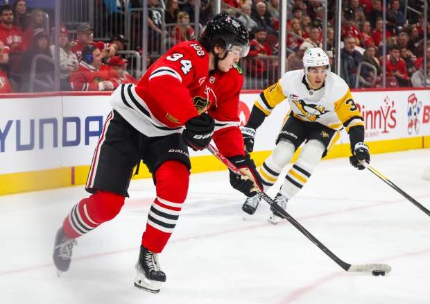 Blackhawks center Colton Dach (34) handles the puck during the first period against the Pittsburgh Penguins, Dec. 28, 2025, at the United Center. (Dominic Di Palermo/Chicago Tribune)