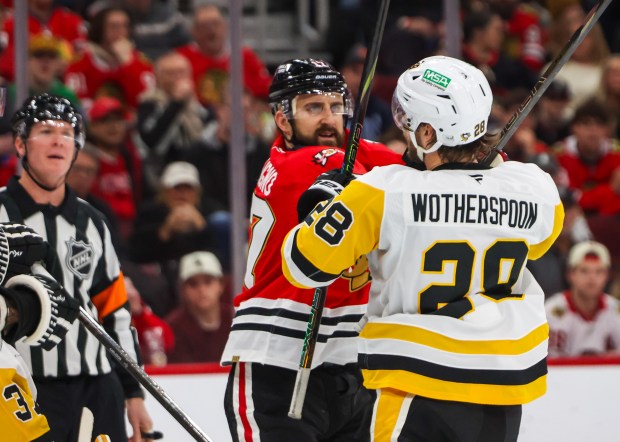 Blackhawks left wing Nick Foligno (17) fights with Pittsburgh Penguins defenseman Parker Wotherspoon (28) during the first period, Dec. 28, 2025, at the United Center. (Dominic Di Palermo/Chicago Tribune)