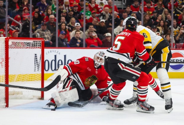 Pittsburgh Penguins right wing Justin Brazeau (16) scores on Blackhawks goaltender Arvid Soderblom (40) during the second period, Dec. 28, 2025, at the United Center. (Dominic Di Palermo/Chicago Tribune)