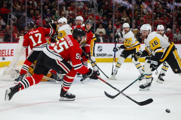Blackhawks defenseman Artyom Levshunov (55) reaches for the puck during the first period against the Pittsburgh Penguins, Dec. 28, 2025, at the United Center. (Dominic Di Palermo/Chicago Tribune)
