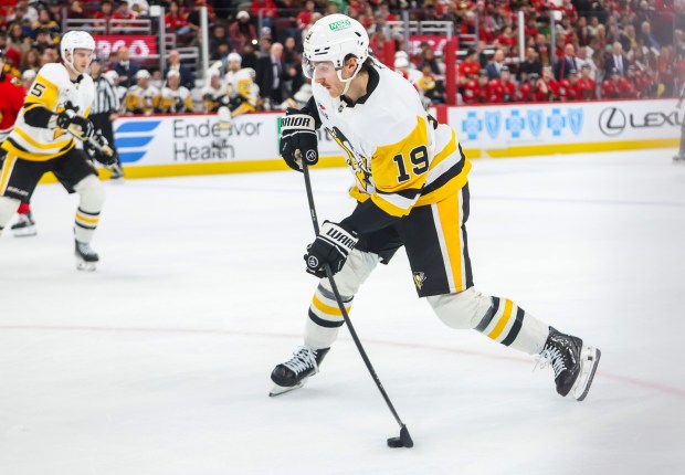 Pittsburgh Penguins center Connor Dewar (19) shoots and scores on Blackhawks goaltender Arvid Soderblom (40) during the second period, Dec. 28, 2025, at the United Center. (Dominic Di Palermo/Chicago Tribune)