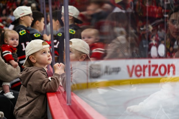 A fan watches Blackhawks players warm up before a game against the Pittsburgh Penguins, Dec. 28, 2025, at the United Center. (Dominic Di Palermo/Chicago Tribune)