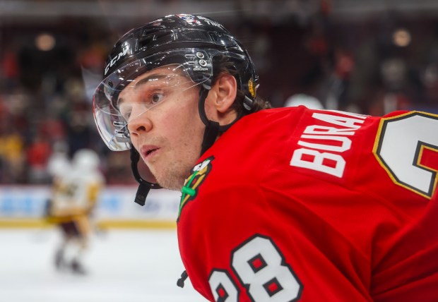 Blackhawks left wing Andre Burakovsky (28) reacts to a teammate during warmups before a game against the Pittsburgh Penguins, Dec. 28, 2025, at the United Center. (Dominic Di Palermo/Chicago Tribune)