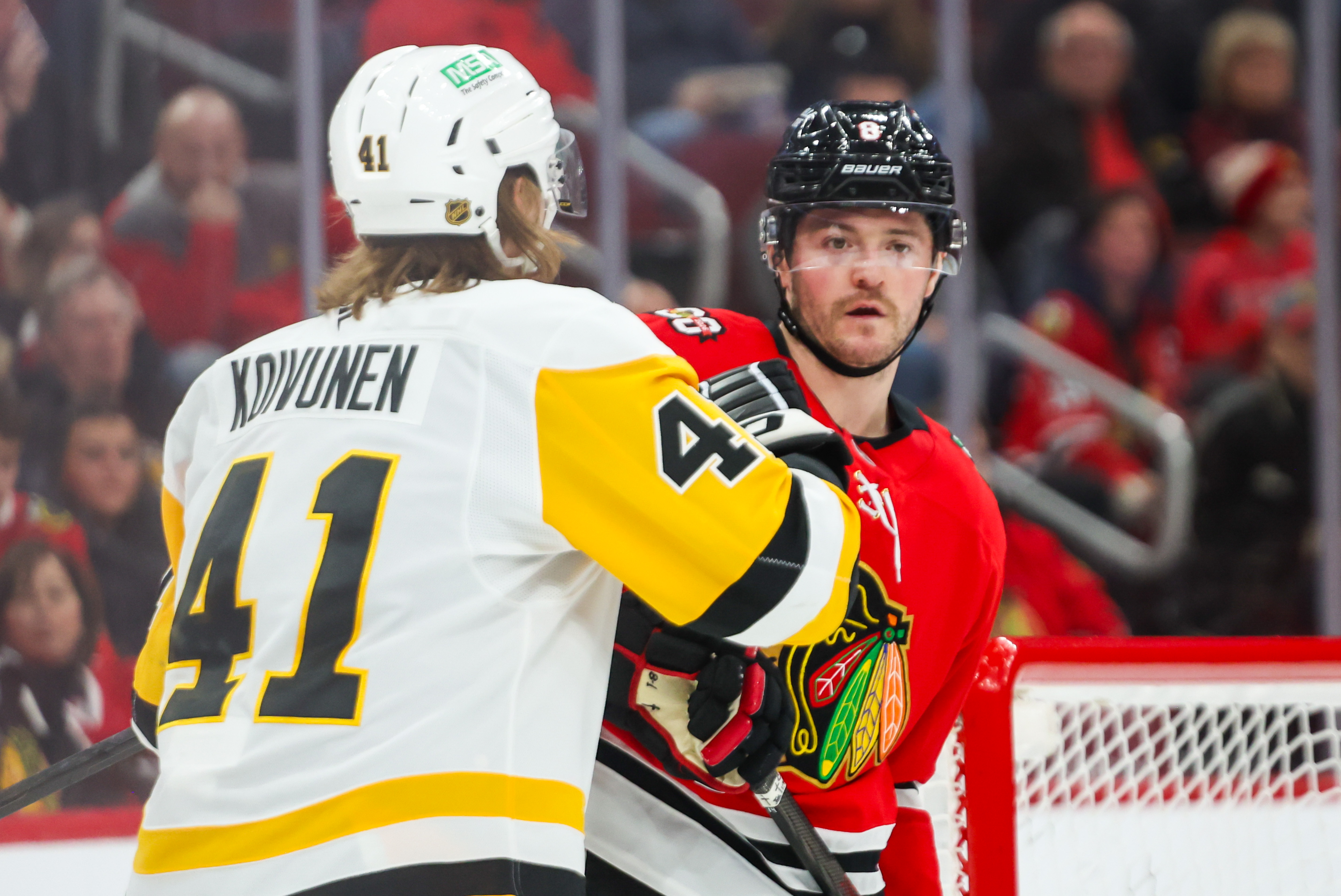 Blackhawks center Ryan Donato (8) and Pittsburgh Penguins right wing Ville Koivunen (41) shove each other during the second period, Dec. 28, 2025, at the United Center. (Dominic Di Palermo/Chicago Tribune)