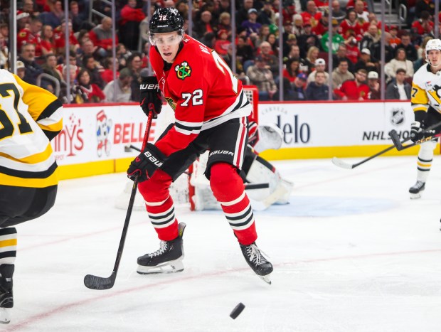 Blackhawks defenseman Alex Vlasic (72) goes for the puck during the second period against the Pittsburgh Penguins, Dec. 28, 2025, at the United Center. (Dominic Di Palermo/Chicago Tribune)