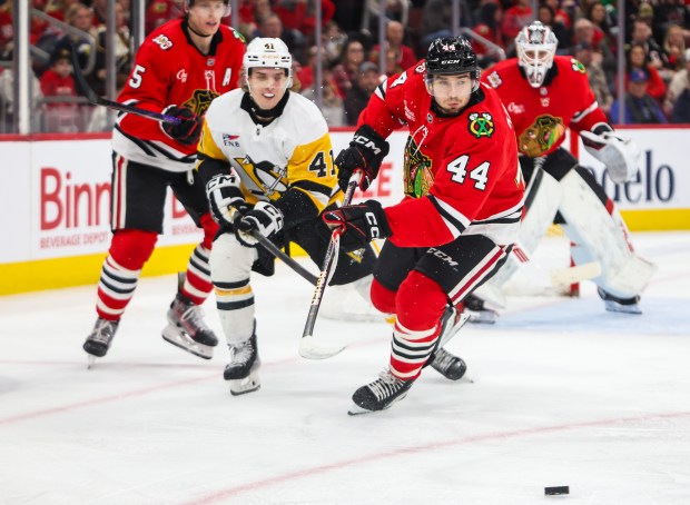 Blackhawks defenseman Wyatt Kaiser (44) chases the puck during the second period against the Pittsburgh Penguins, Dec. 28, 2025, at the United Center. (Dominic Di Palermo/Chicago Tribune)