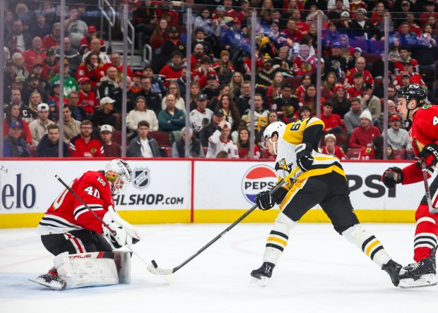 Pittsburgh Penguins right wing Rickard Rakell (67) shoots on Blackhawks goaltender Arvid Soderblom (40) during the second period, Dec. 28, 2025, at the United Center. (Dominic Di Palermo/Chicago Tribune)