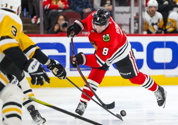 Blackhawks center Ryan Donato (8) shoots on goal during the third period against the Pittsburgh Penguins, Dec. 28, 2025, at the United Center. (Dominic Di Palermo/Chicago Tribune)