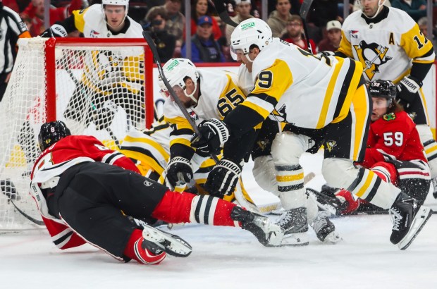 Blackhawks center Ryan Donato (8) dives to shoot the puck during the first period against the Pittsburgh Penguins, Dec. 28, 2025, at the United Center. (Dominic Di Palermo/Chicago Tribune)