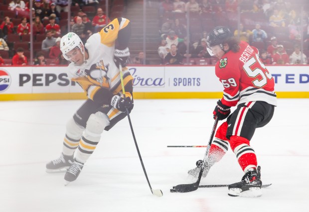 Blackhawks left wing Tyler Bertuzzi (59) drives the net and scores past Pittsburgh Penguins defenseman Jack St. Ivany (3) in the last few seconds of the third period, Dec. 28, 2025, at the United Center. (Dominic Di Palermo/Chicago Tribune)