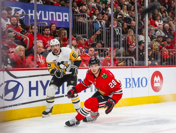 Pittsburgh Penguins defenseman Erik Karlsson (65) launches the puck around the glass during the second period against the Blackhawks, Dec. 28, 2025, at the United Center. (Dominic Di Palermo/Chicago Tribune)