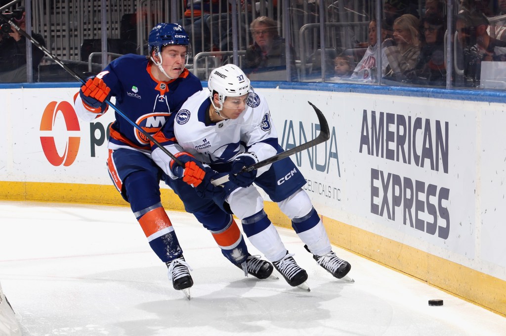 Rookie Cal Ritchie checks Yanni Gourde during the Islanders' win over the Lightning on Dec. 2, 2025.
