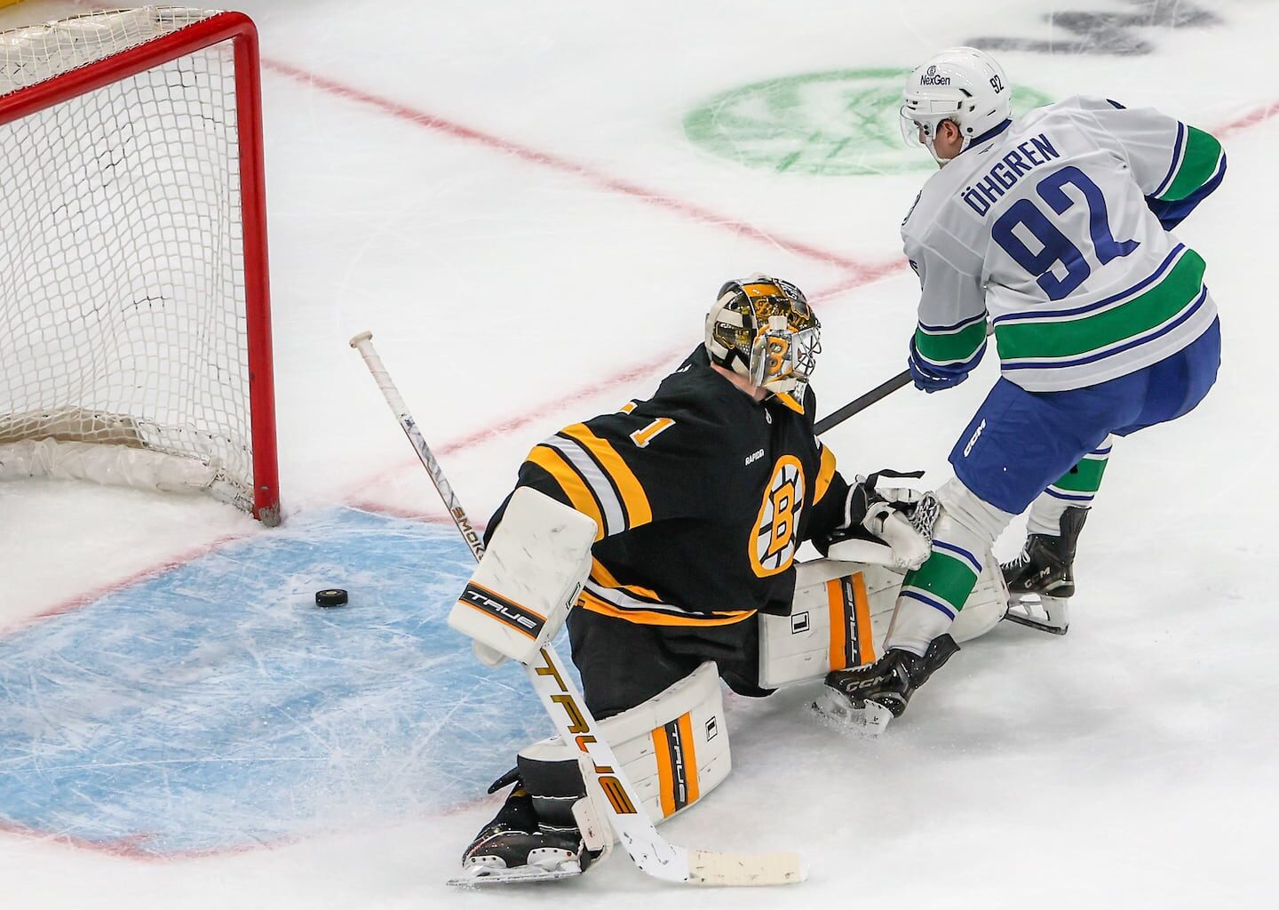 Liam Ohgren slipped the puck by Jeremy Swayman for the only shootout goal in the Canucks' win at TD Garden.