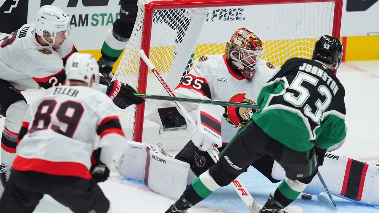 Dallas Stars center Wyatt Johnston (53) scores a goal against Ottawa Senators goaltender Linus Ullmark (35), center Lars Eller (89) and defenseman Artem Zub (2) during the third period of an NHL hockey game Sunday, Nov. 30, 2025, in Dallas. (AP Photo/LM Otero)