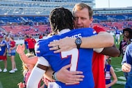SMU head coach Rhett Lashlee hugs quarterback Kevin Jennings (7) after the Mustangs' 31-18...